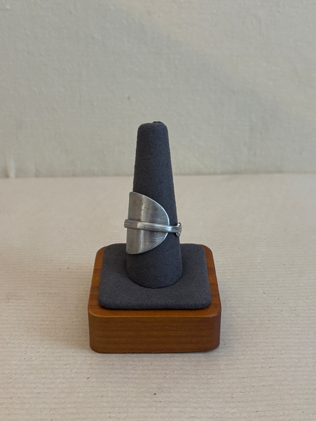 silver ring on a ring display
