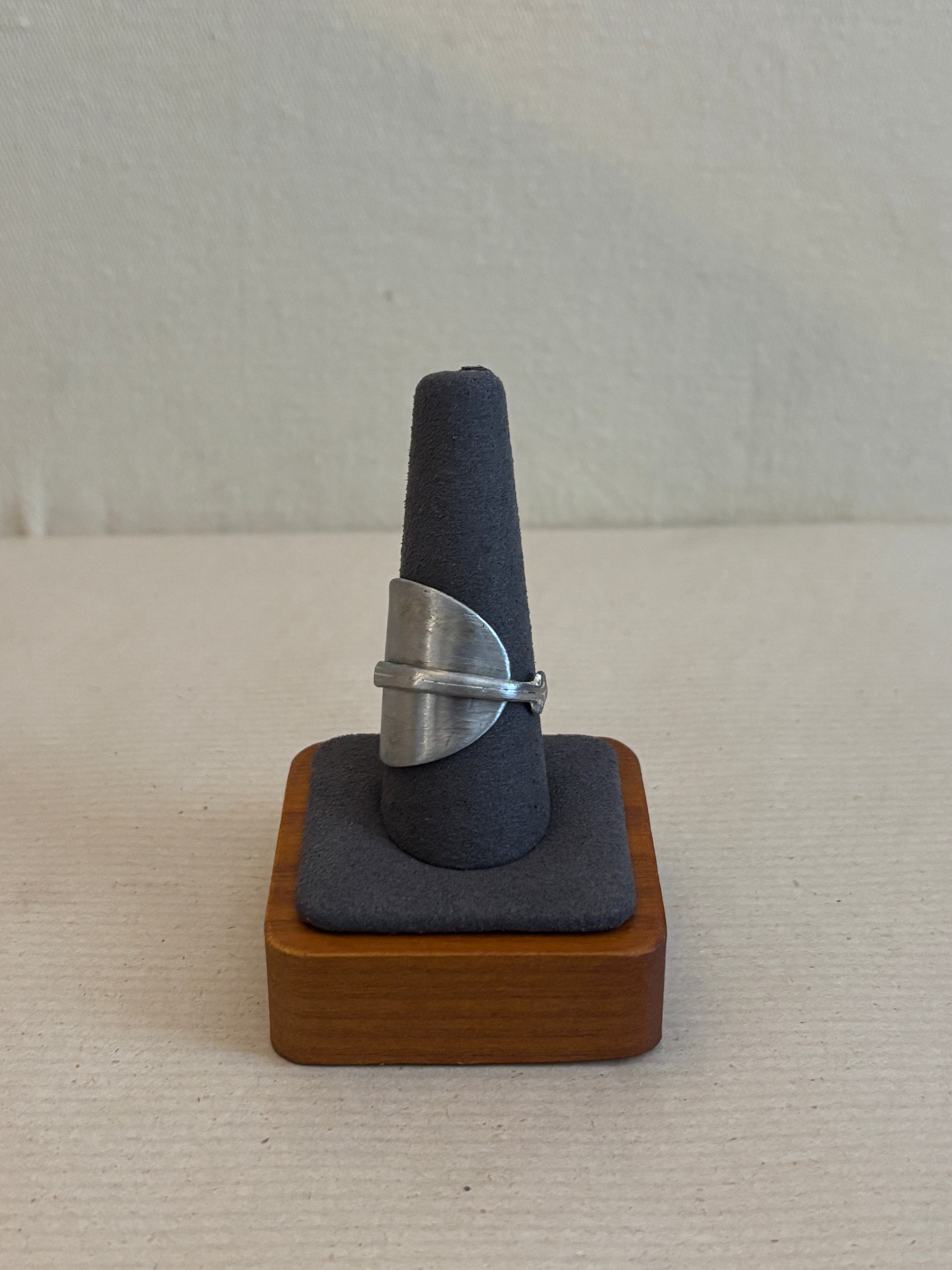 silver ring on a ring display